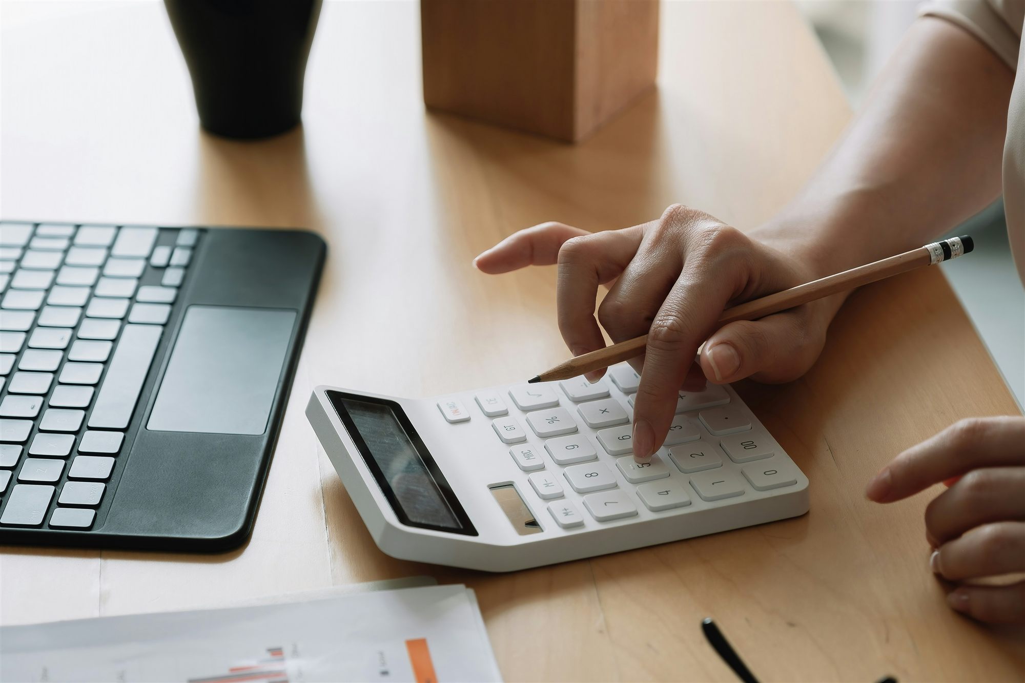 Reviewing budget with a calculator