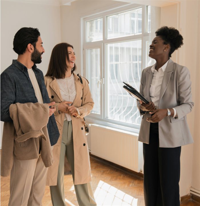 Agent showing a home to a couple