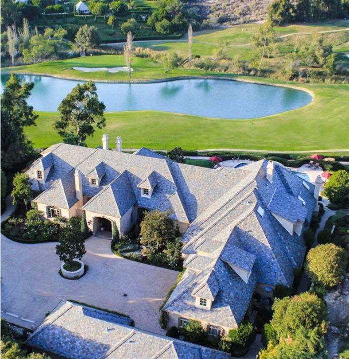 Aerial view of a luxury estate near a golf course
