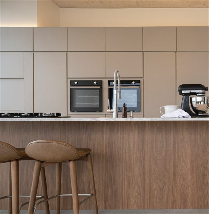 Modern kitchen with a wood island